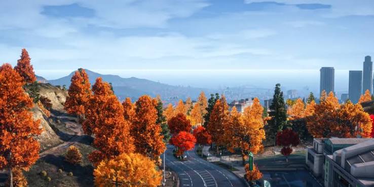 Autumn hillside road overlooking the city